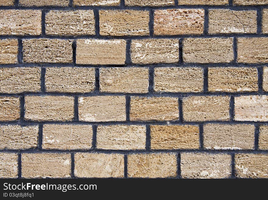 Brick wall made from yellow a shell rock. Brick wall made from yellow a shell rock