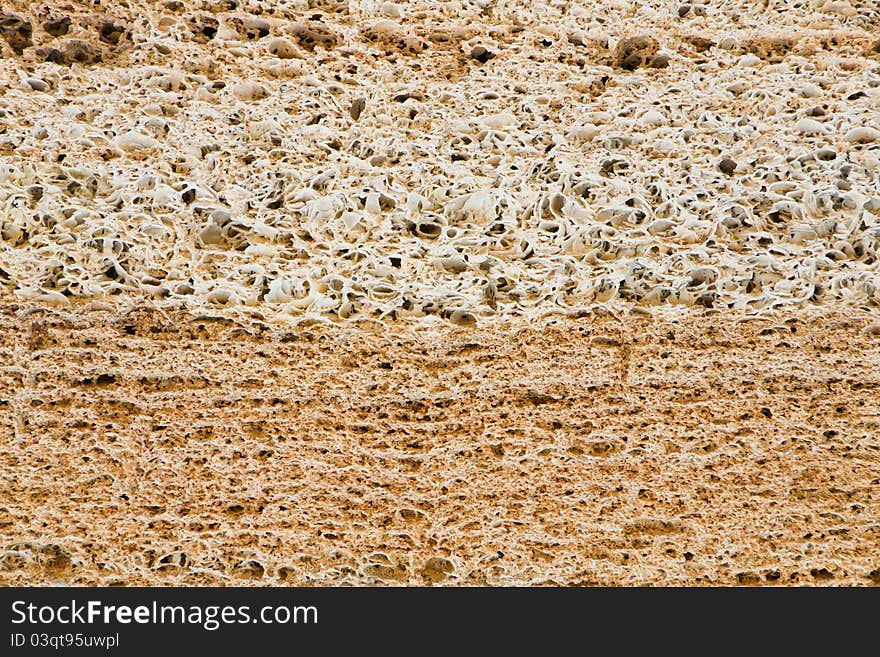 Layers of a natural building material of yellow and white colour. Layers of a natural building material of yellow and white colour