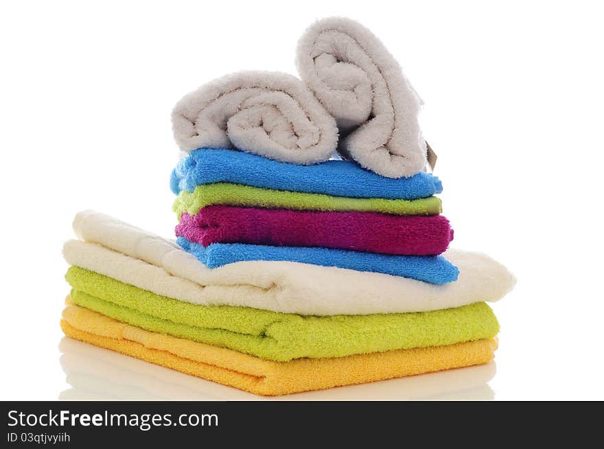 Colorful towels made in a studio with a white background. Colorful towels made in a studio with a white background