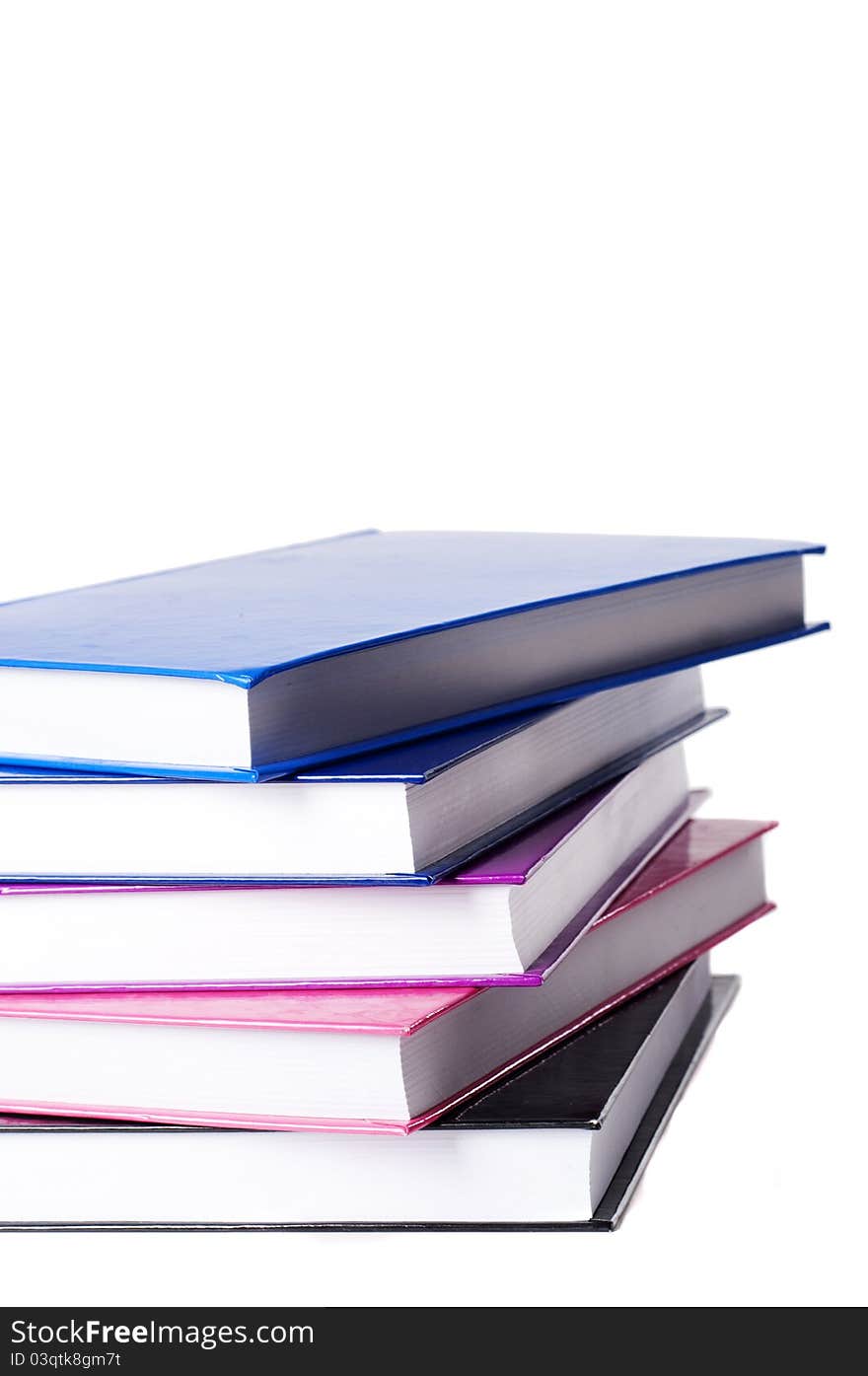 Pile of colorful books isolated