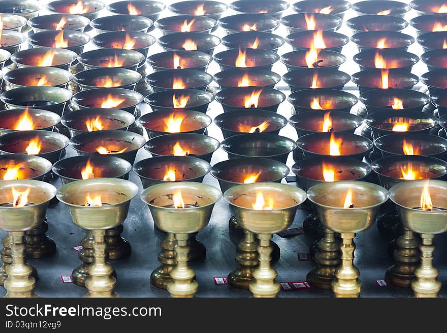 Buddhist butter lamps in temple