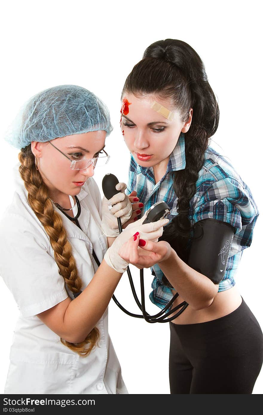 Nurse and patient looking at the Blood Pressure Monitor on a white background. Nurse and patient looking at the Blood Pressure Monitor on a white background