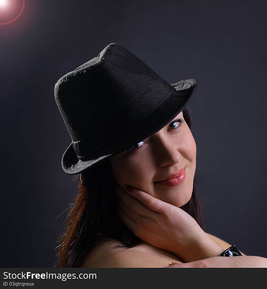 Portrait of a beautiful young woman in hat. Portrait of a beautiful young woman in hat