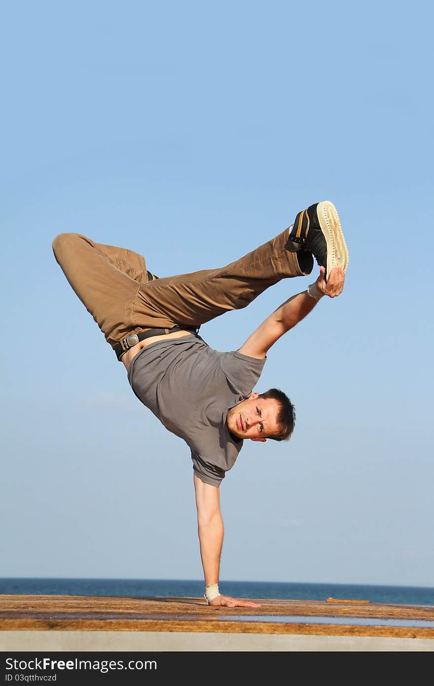 Male breakdancer on natural background