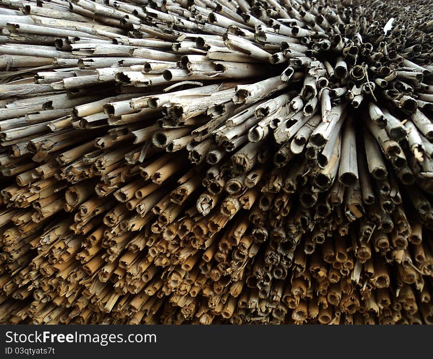 Detail of a straw roof of an cottage. Detail of a straw roof of an cottage