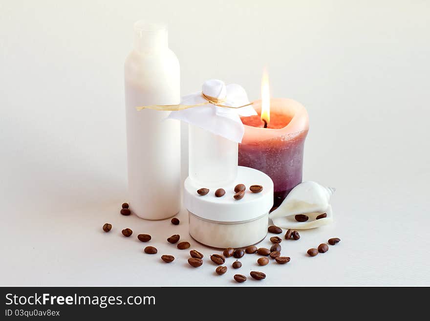 Cream, shell, coffee beans and candles. Cream, shell, coffee beans and candles