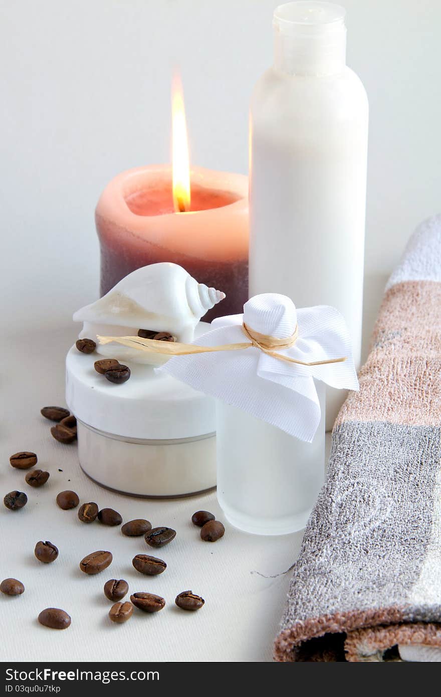 Cream, shell, coffee beans and candles. Cream, shell, coffee beans and candles