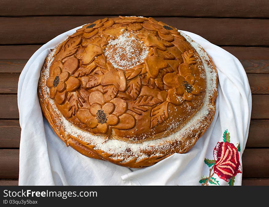 Fresh loaf of bread on the table with white napkin