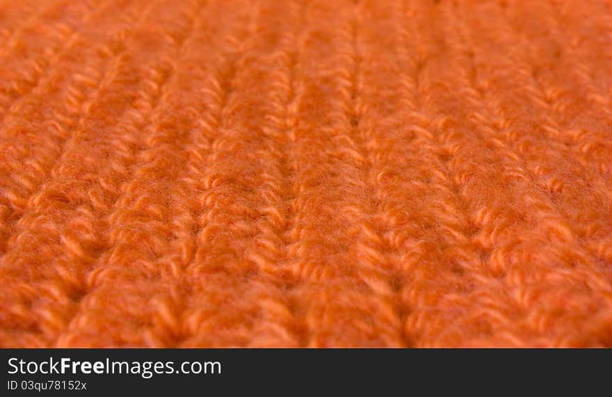 Orange knit macro, focus on the central part of it. Orange knit macro, focus on the central part of it.