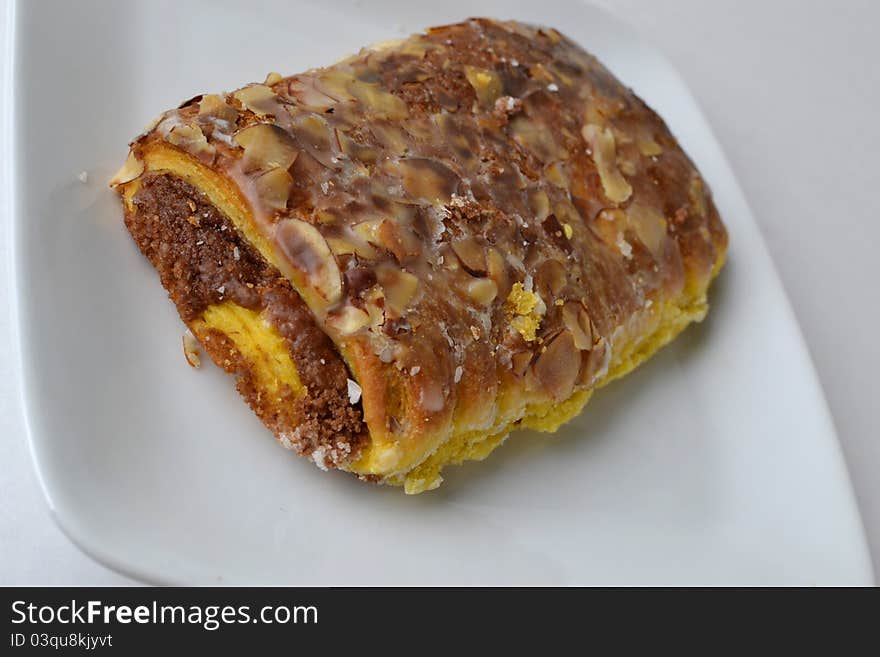 Fresh made almond bear claw served for breakfast with butter. Fresh made almond bear claw served for breakfast with butter.