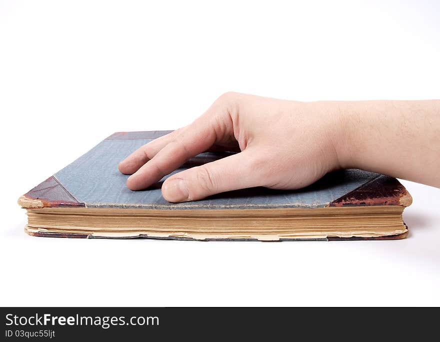 Color photo of an old book and hands. Color photo of an old book and hands