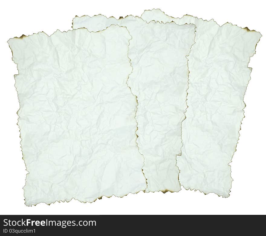 Crumpled paper with burnt edges over white