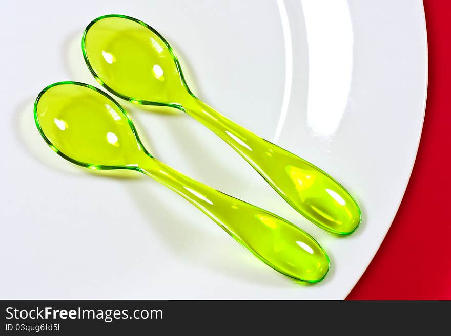 Two Yellow Plastic Spoons