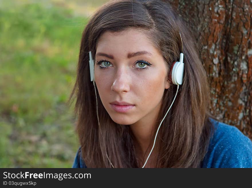 Young Woman Listening Music