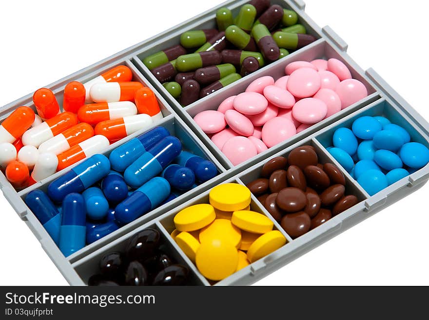 Box with colored medical pills. Box with colored medical pills