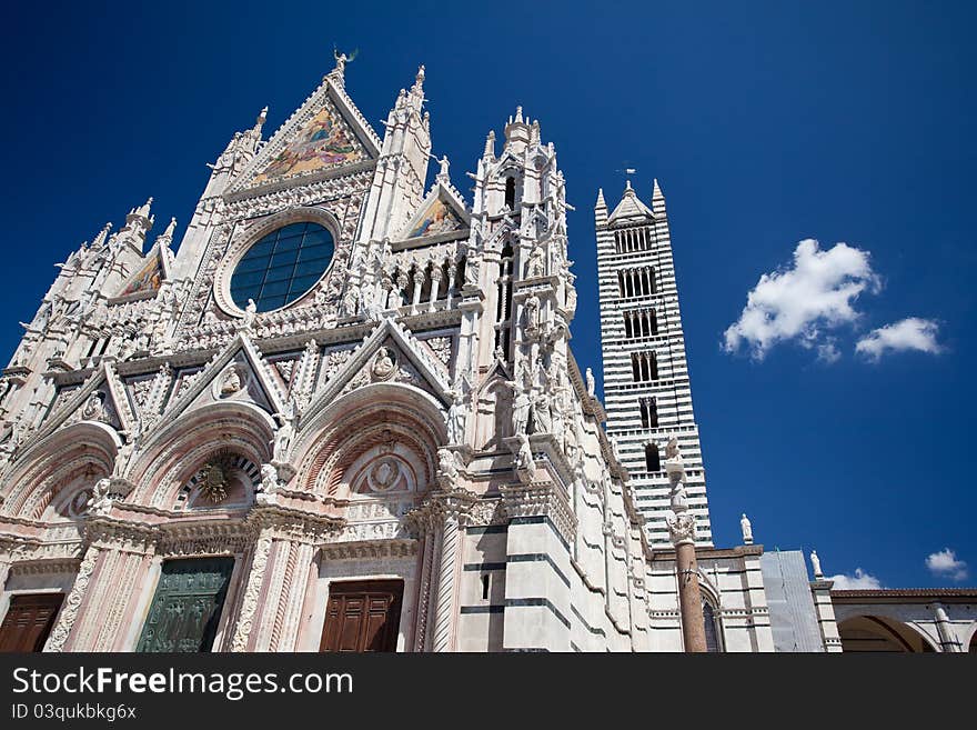 The ancient cathedral of Siena with its bell tower. The ancient cathedral of Siena with its bell tower