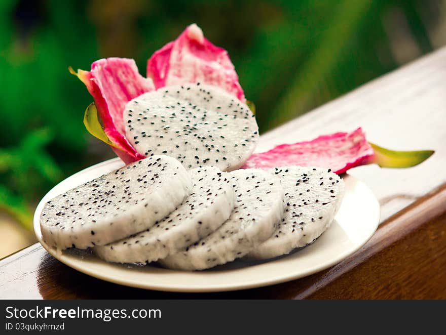 Bright, Vivid and tasty fruit Dragon sliced on a plate. Bright, Vivid and tasty fruit Dragon sliced on a plate