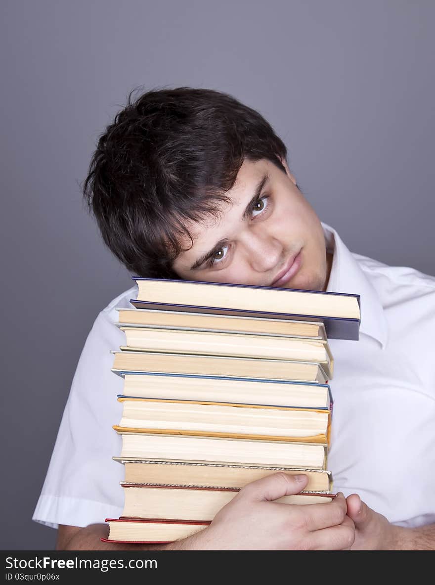 Funny man with books. Studio shot. Funny man with books. Studio shot.