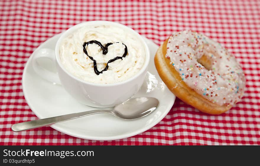 Donuts With Coffee On Table.