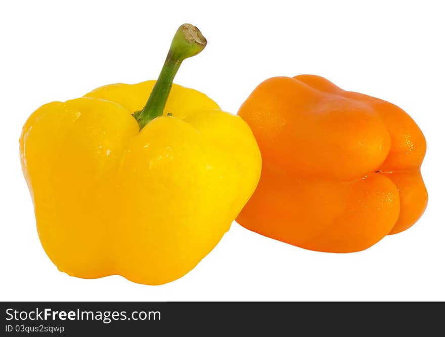 Two sweet peppers - yellow and orange isolated on white background. Two sweet peppers - yellow and orange isolated on white background