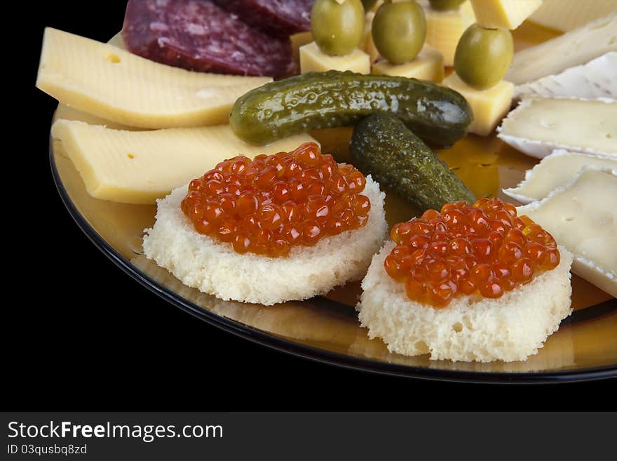 Plate with Caviar Canapes, Cheese and Grapes