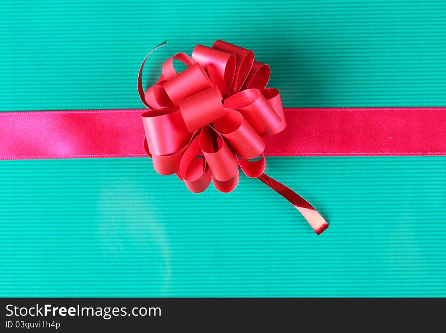 Color photo of a bow on red ribbon. Color photo of a bow on red ribbon