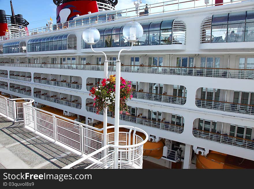 A side view of a cruise ship at Canada Place in Vancouver BC Canada. A side view of a cruise ship at Canada Place in Vancouver BC Canada.