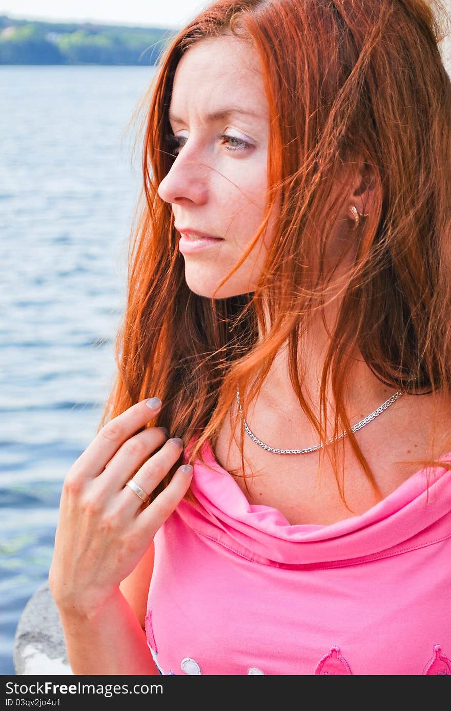 Beautiful woman standing near lake. Beautiful woman standing near lake