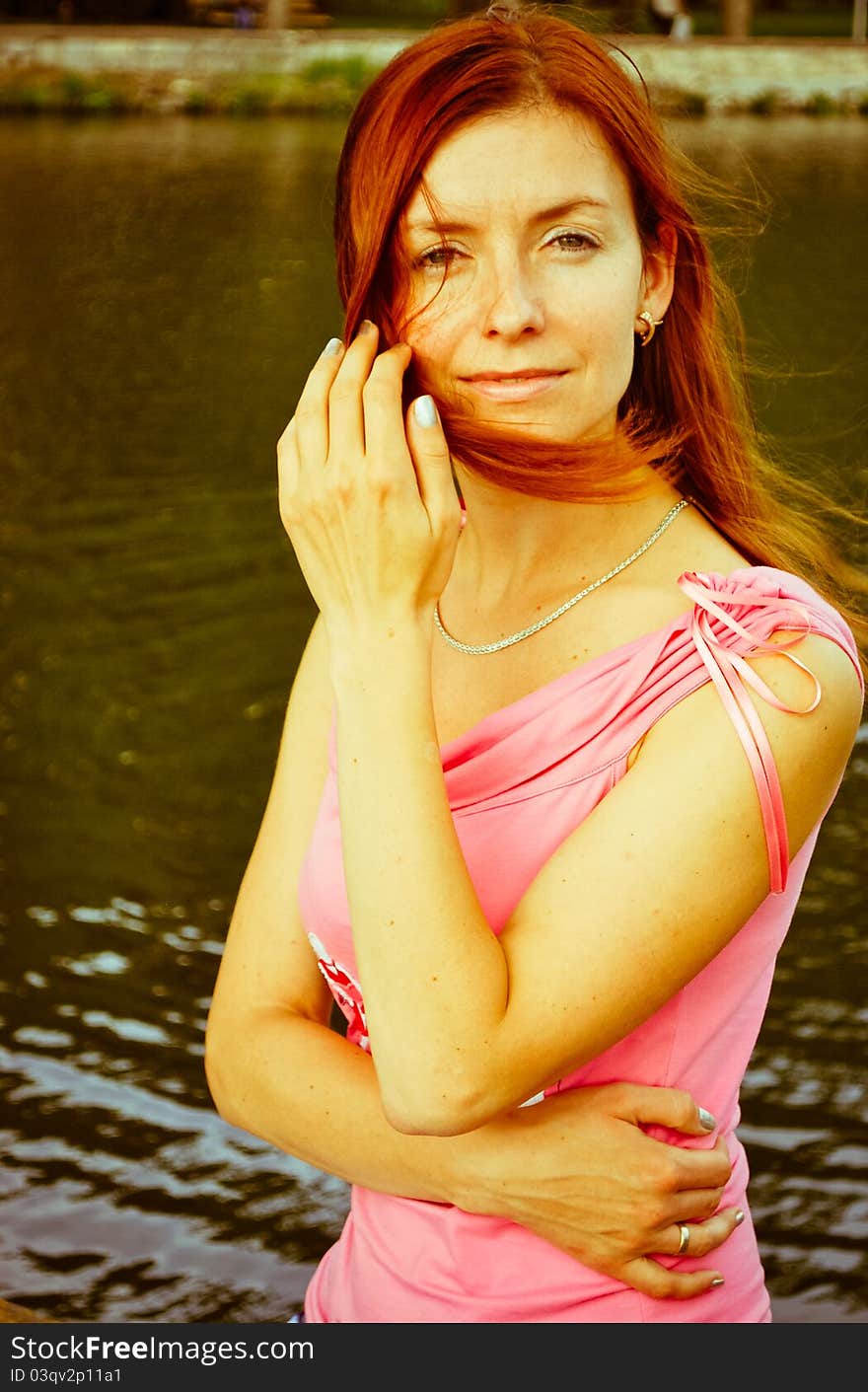 Beautiful woman standing near lake. Beautiful woman standing near lake