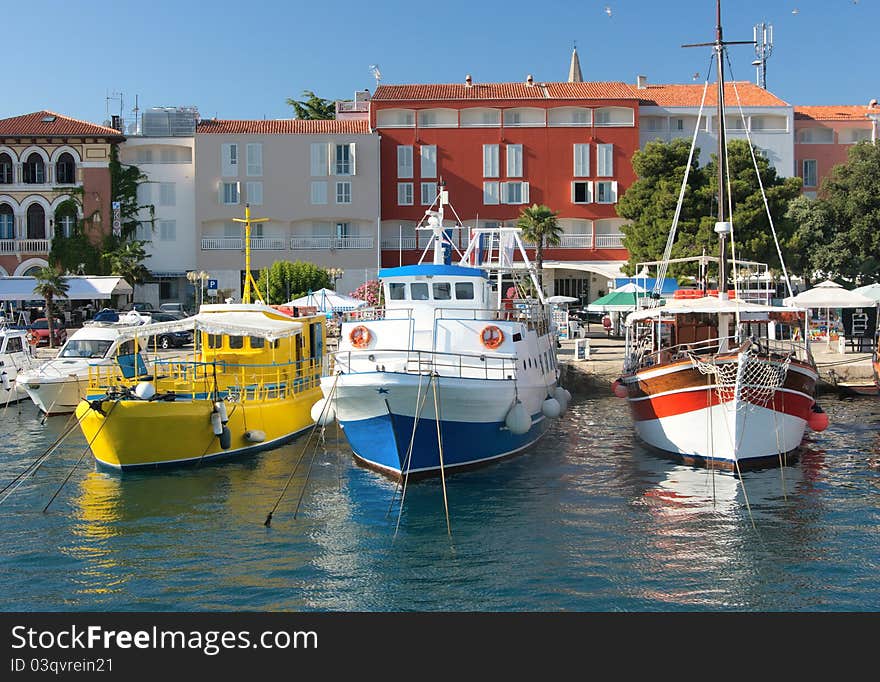 Three colorful ship moored in a small european town. Three colorful ship moored in a small european town