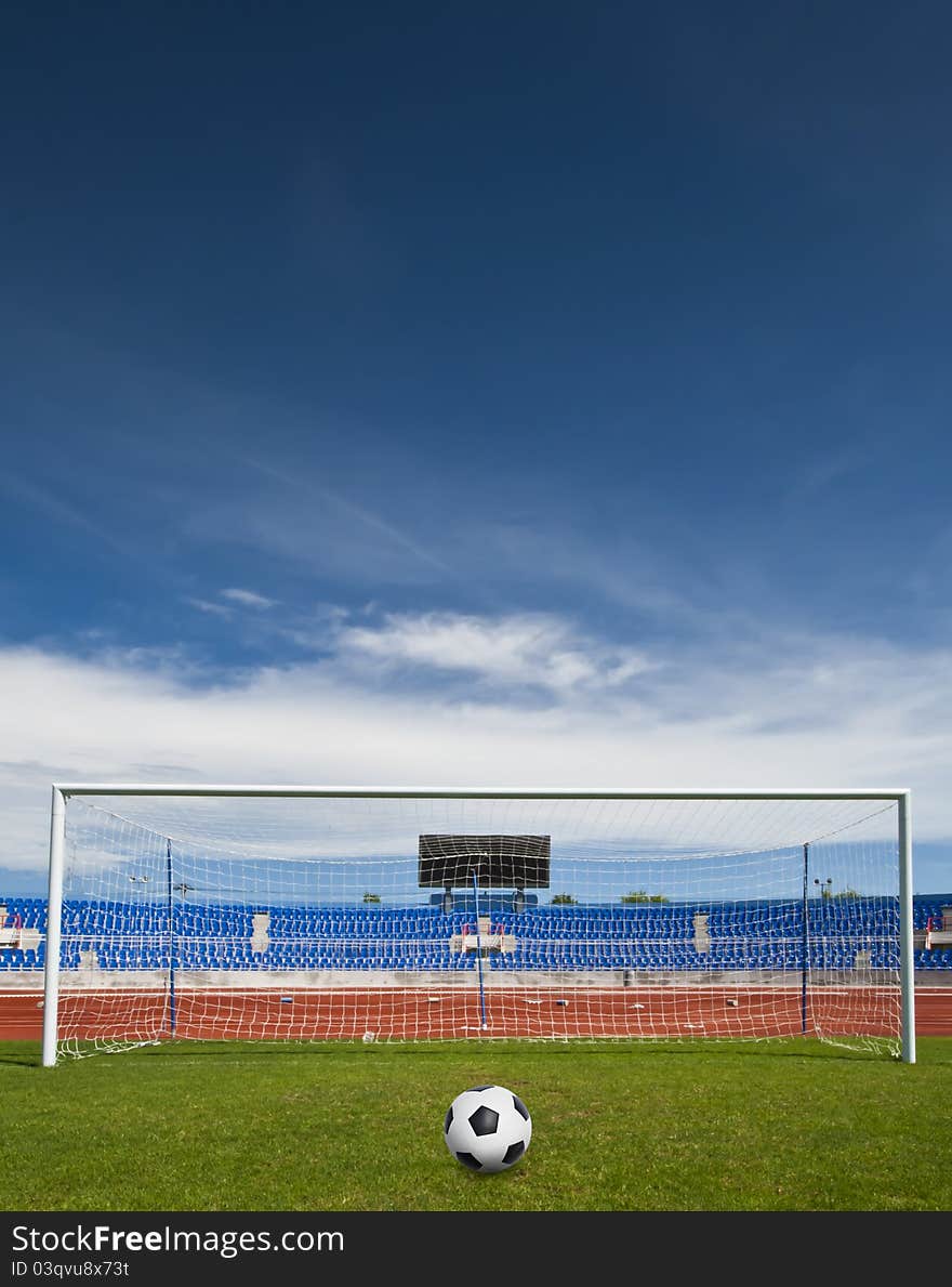 A ball on the green grass of football field. A ball on the green grass of football field