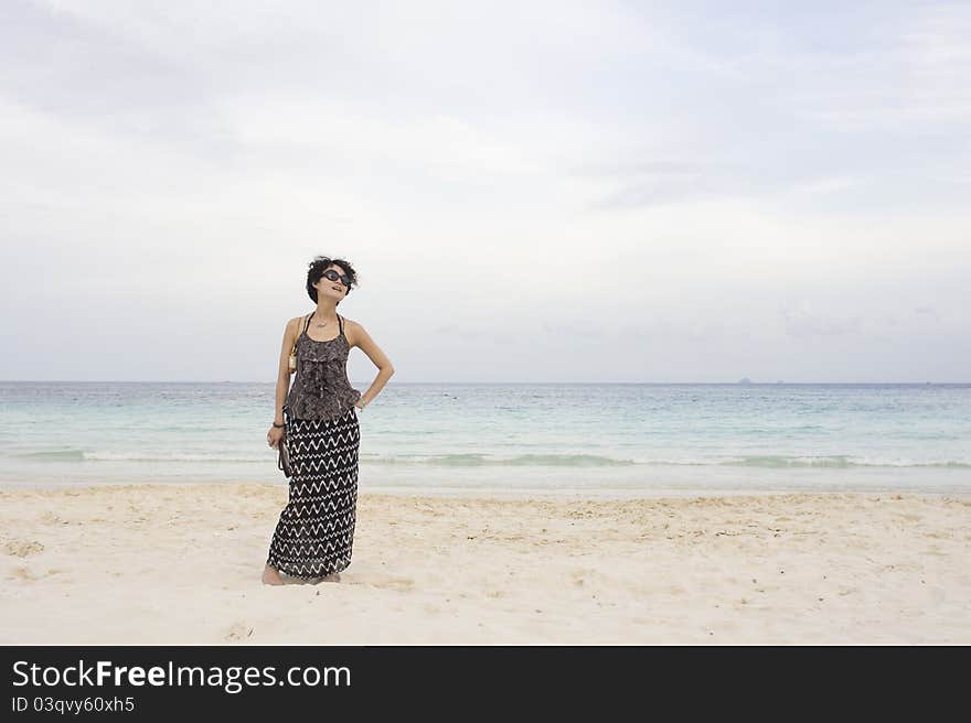 One Chinese girl standing on seashore alone. One Chinese girl standing on seashore alone