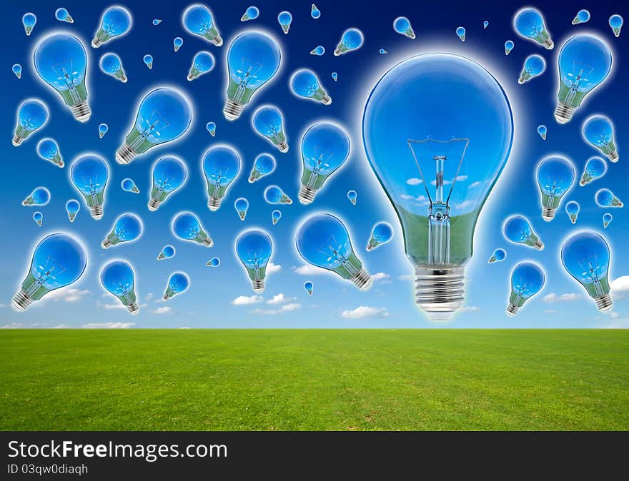 Many blubs on the blue sky. Ecological concept, reflection of nature in lamps.