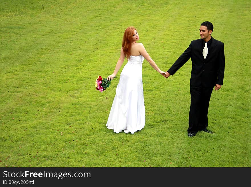 Bride and Groom on Green Lawn