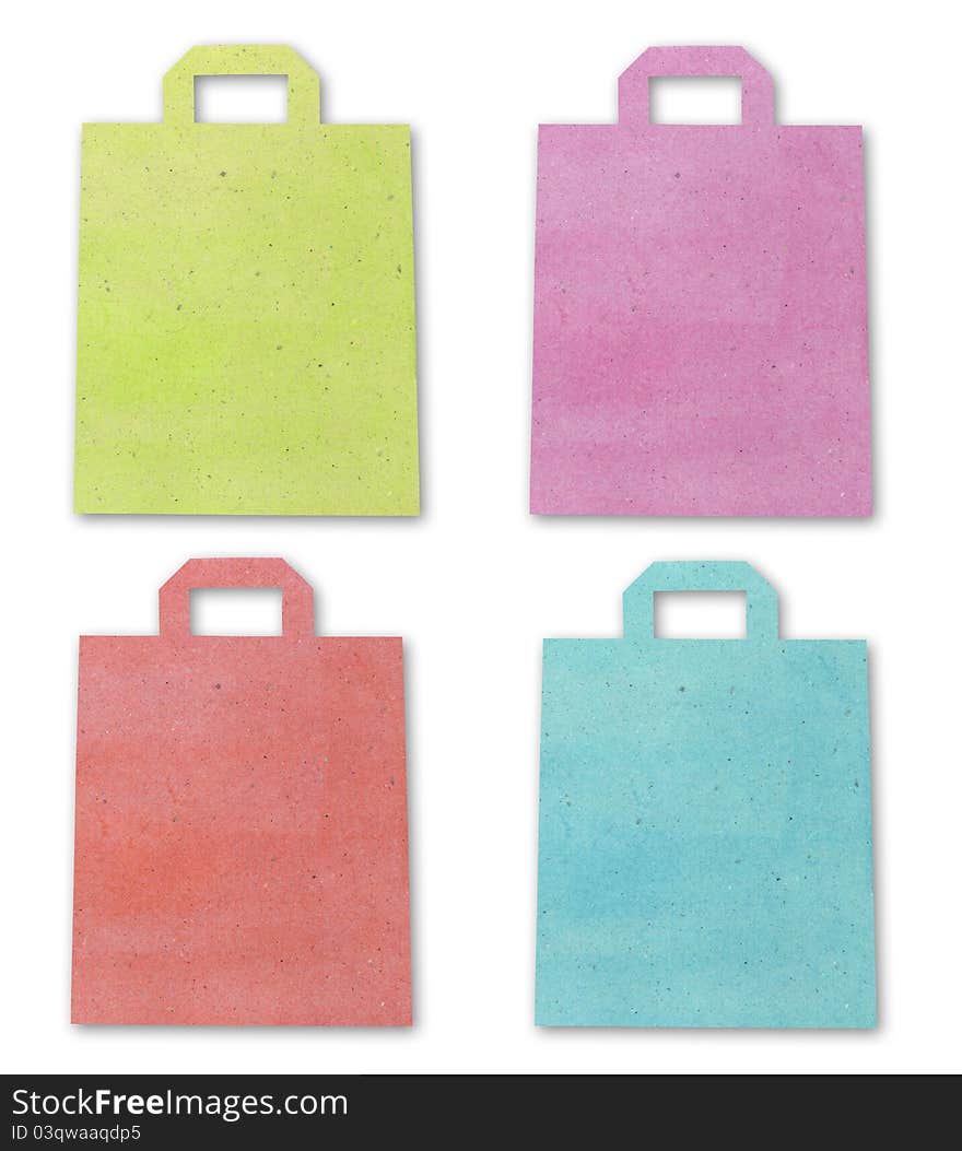 Color shopping bag recycle paper craft stick isolated on white