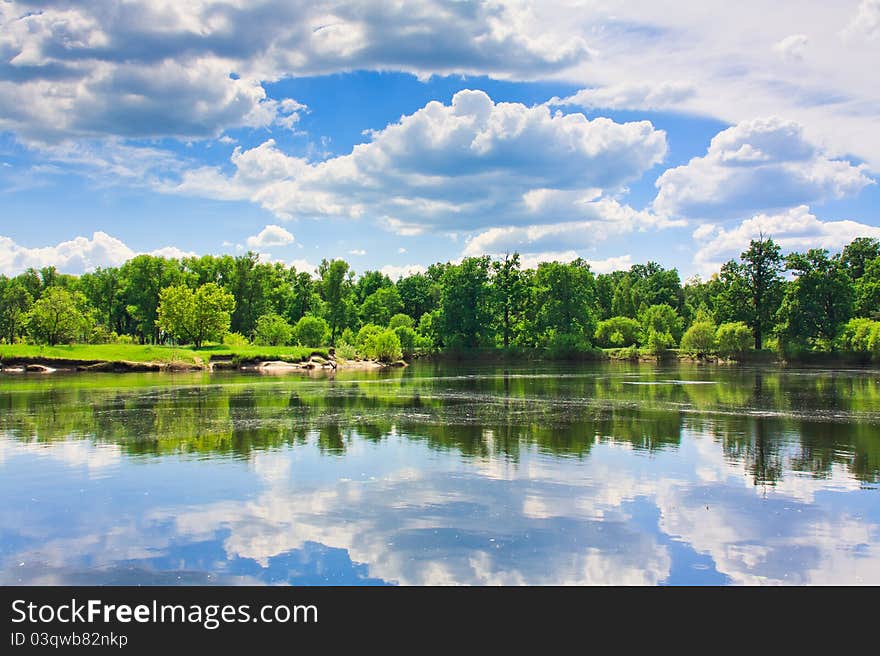 Clouds Reflection On Lake.