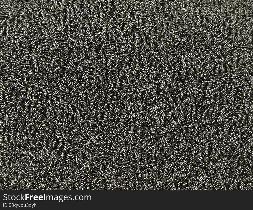 Background of tangled and compressed steel wire.