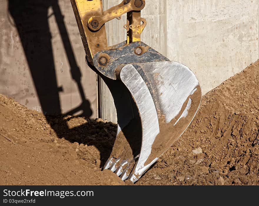 Excavator digging a deep trench