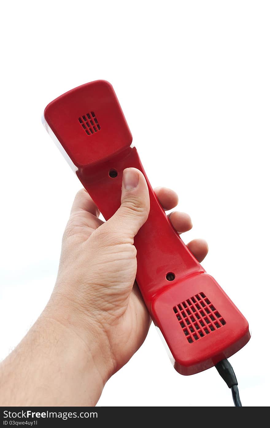 Red old telephone in hand