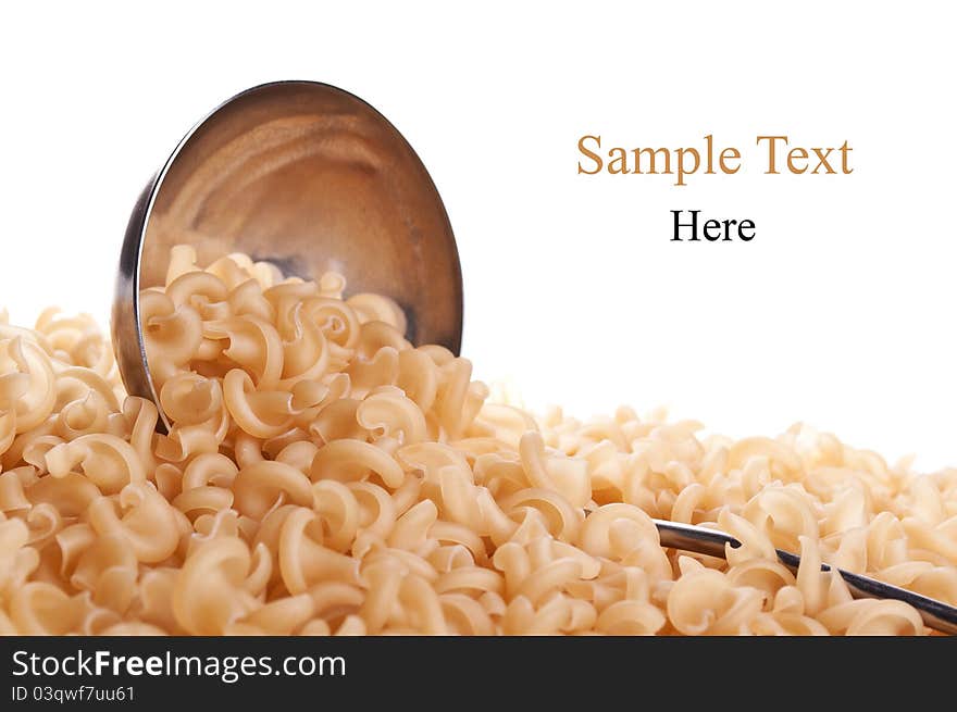 Scoop and raw pasta isolated on a white background