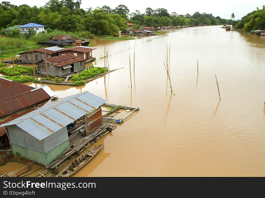 A wooden house on the water. A wooden house on the water.