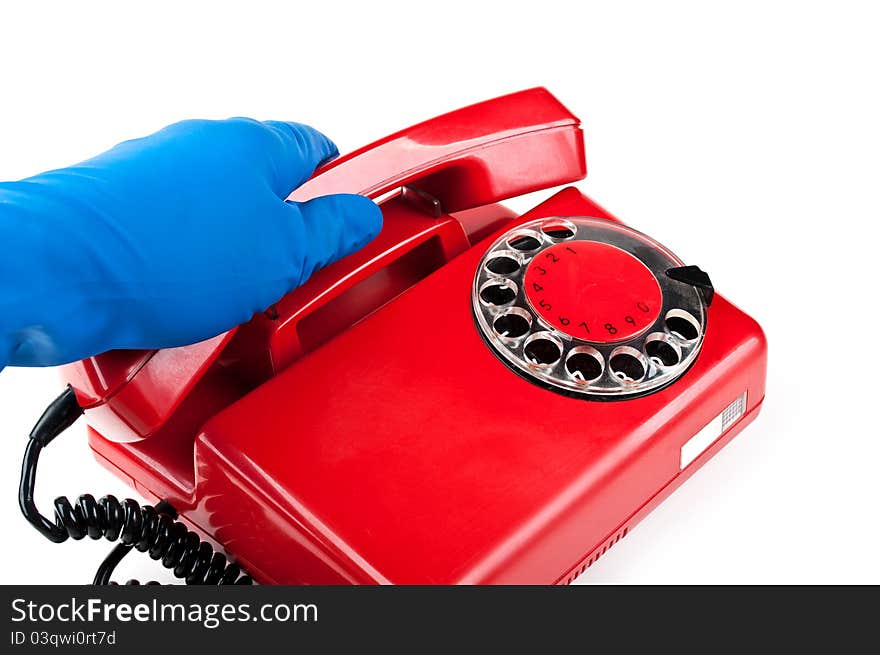 Man in blue gloves picked it up the red phone isolated on a white background. Man in blue gloves picked it up the red phone isolated on a white background