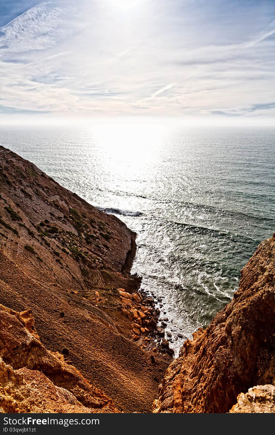 Beautiful cliff over the Atlantic Ocean in region of Sesimbra. Beautiful cliff over the Atlantic Ocean in region of Sesimbra.