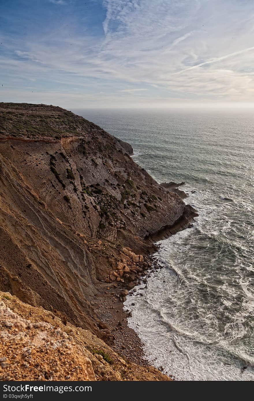 Beautiful cliff over the Atlantic Ocean in region of Sesimbra. Beautiful cliff over the Atlantic Ocean in region of Sesimbra.