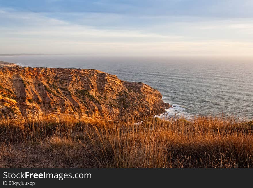 Beautiful cliff over the Atlantic Ocean in region of Sesimbra. Beautiful cliff over the Atlantic Ocean in region of Sesimbra.