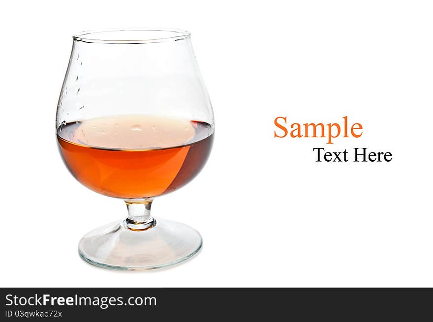 Cognac in a classic glass isolated on a white background