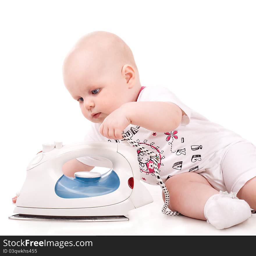 Sweet baby girl playing with iron. Isolated over white background. Sweet baby girl playing with iron. Isolated over white background