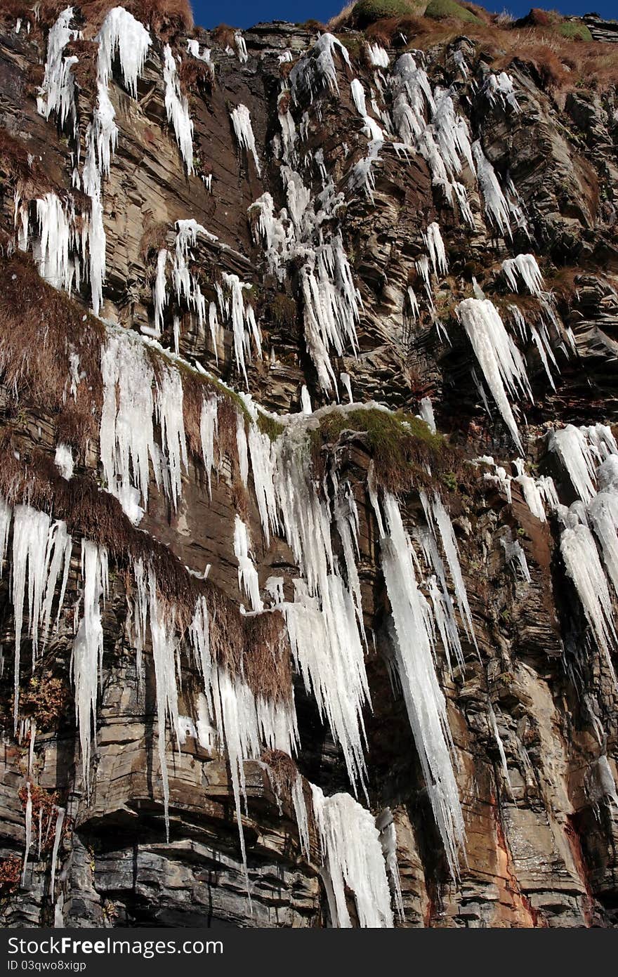 Frozen Icicles On A Cliff Face