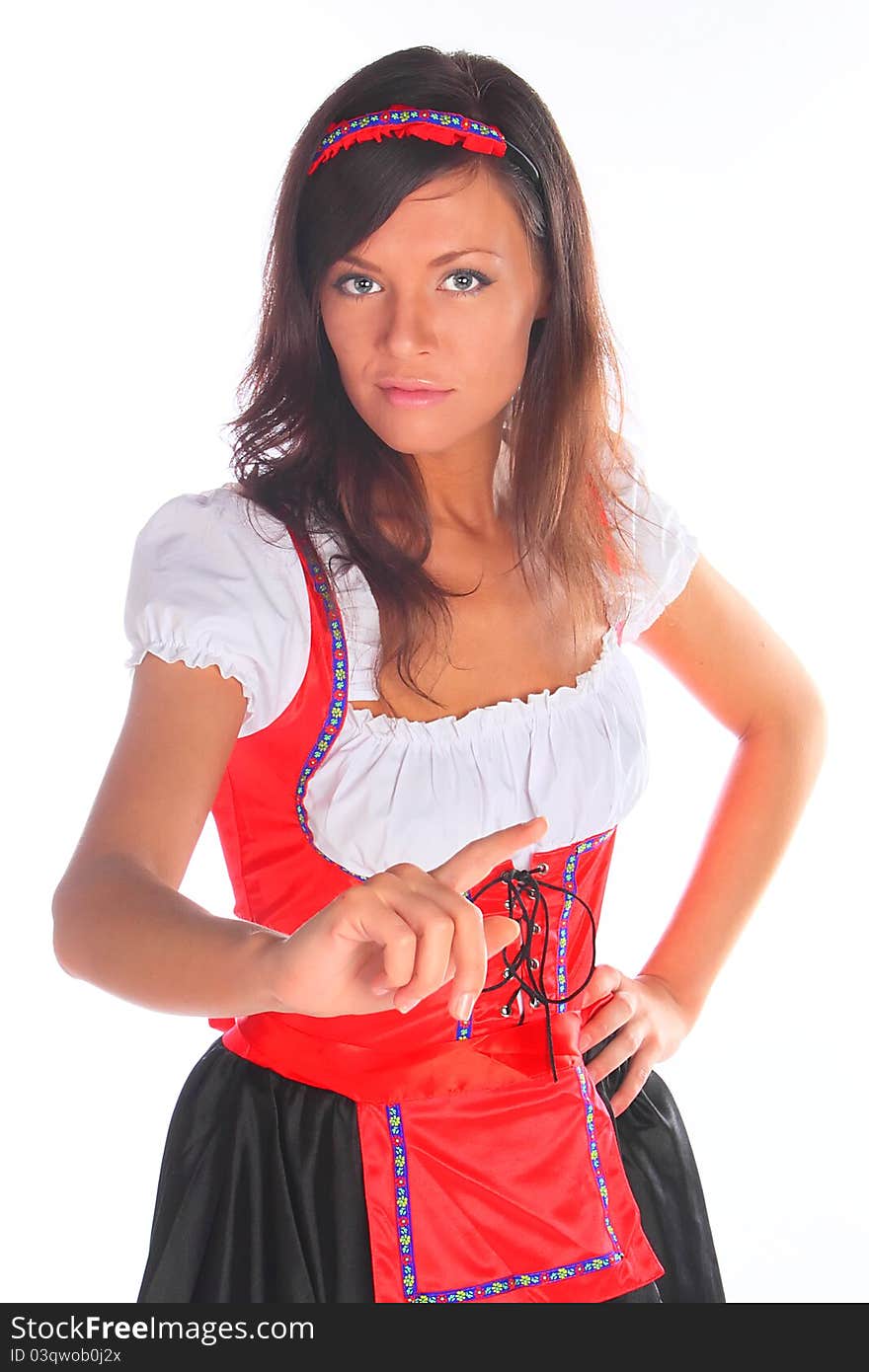 The girl in a traditional Bavarian dress with full glasses of beer in hands