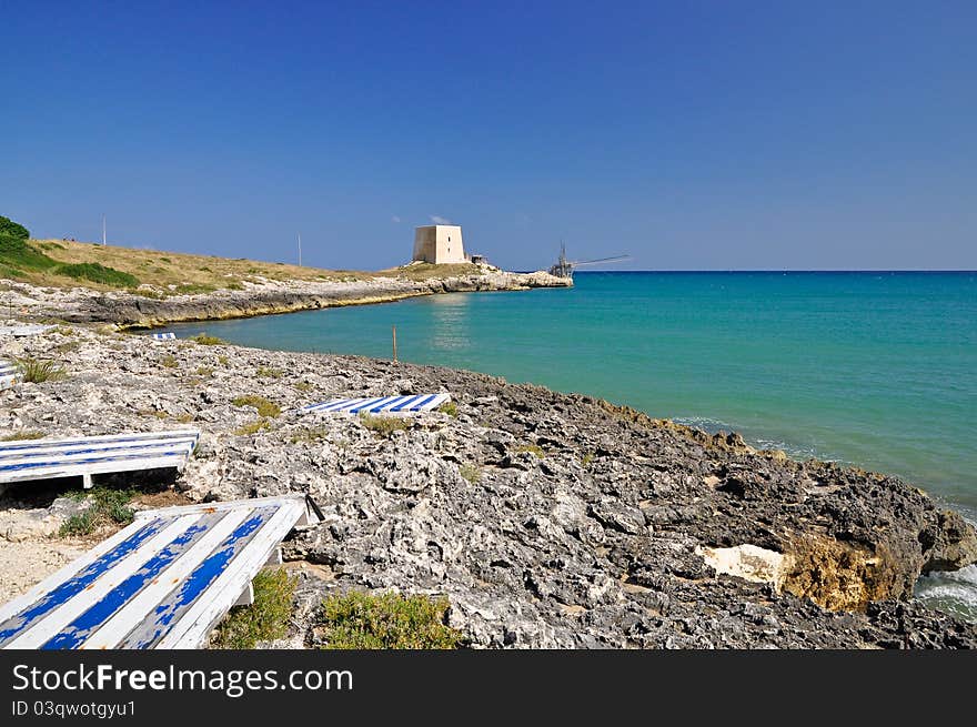 Bay of Manacore, near Peschici, with an ancient Torre Saracena, typical lookout tower of the coast of Gargano. Apulia. Italy. Bay of Manacore, near Peschici, with an ancient Torre Saracena, typical lookout tower of the coast of Gargano. Apulia. Italy.